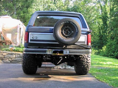 1986 Ford Bronco - Rear view of a 1986 Ford Bronco, showing the spare tire and license plate.