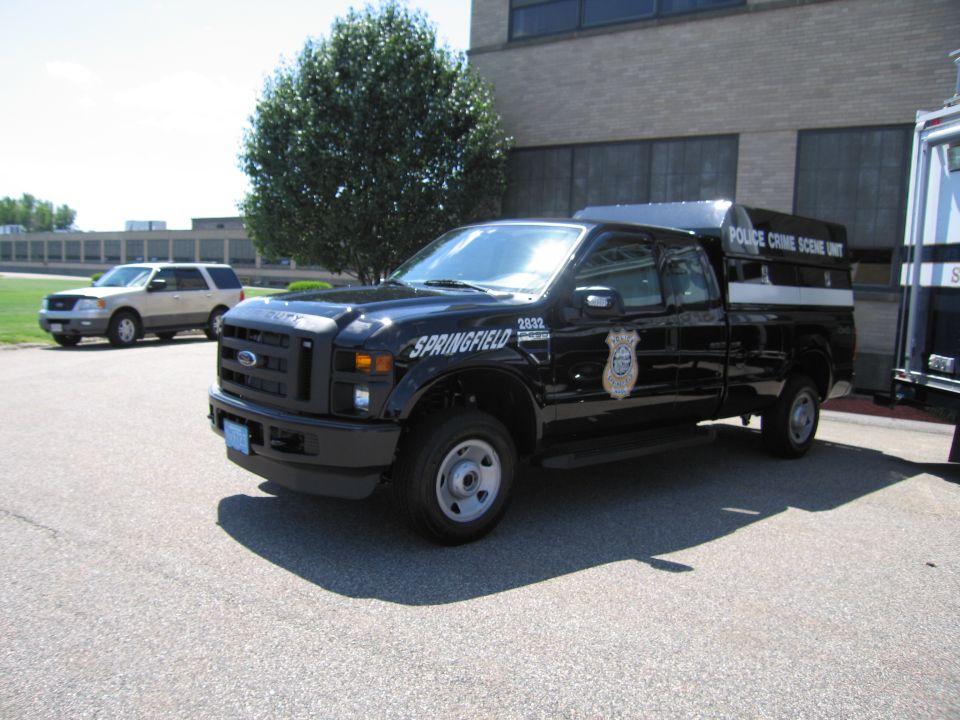 Black Ford F-250 Springfield Police crime scene unit pickup truck in a parking lot