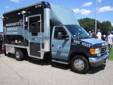 1991 Ford LTD Crown Victoria - blue Massachusetts State Police 'Incident Command' box truck on a Ford cutaway chassis parked at an outdoor event.