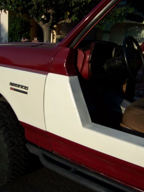 1991 Ford Bronco - This 1991 Ford Bronco features a unique half-door conversion, altering its classic side profile.