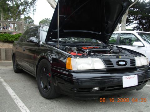 1995 Ford Taurus - 1995 Ford Taurus at a meet, hood up to display the engine.