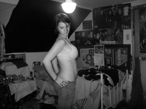 1979 Ford Bronco - A young woman poses in a messy bedroom environment.