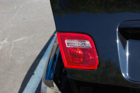 2002 BMW M3 - Close-up of the rear tail light assembly on a black BMW M3.