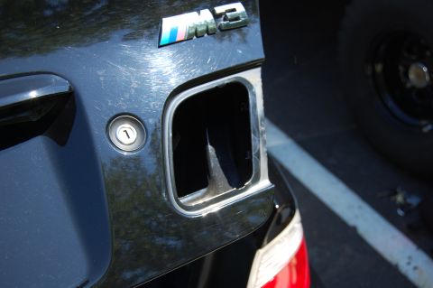 2002 BMW M3 - Close-up of the M3 emblem and fuel filler door on a 2002 BMW M3.