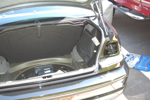 2002 BMW M3 - Trunk interior of a 2002 BMW M3 with the driver's side taillight removed for access.