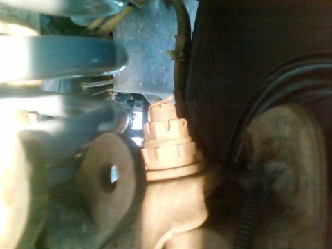 1995 Ford Bronco - Undercarriage view shows suspension components and a tire, with Supermotors.net branding.