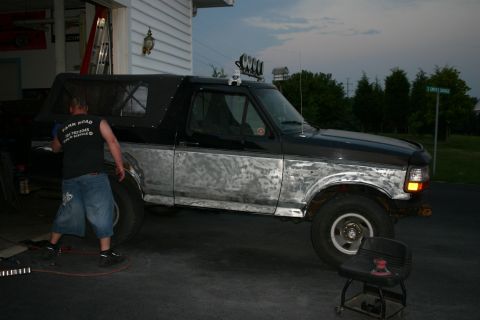 1993 Ford Bronco - Ford Bronco undergoing bodywork with primer applied to the lower sections.
