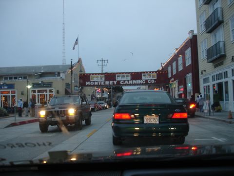 1990 Ford Taurus - Rear view of a 1990 Ford Taurus driving down a street in Monterey, California.