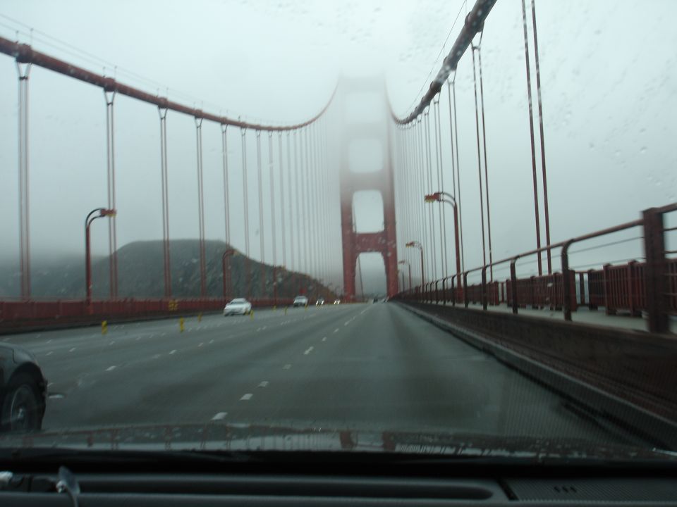 View from car on Golden Gate Bridge in fog