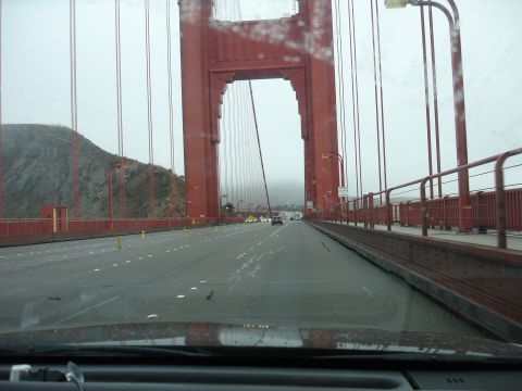 1990 Ford Taurus - Driving across the Golden Gate Bridge, with fog obscuring the view and traffic ahead.