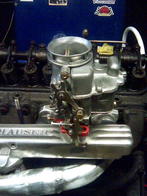 1953 Ford Mainline - A detailed view of a carburetor mounted on an engine, with "HAUSER" inscribed on the intake manifold.