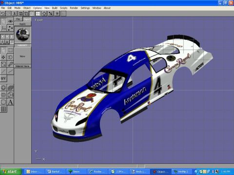 2004 Jeep Wrangler - A 3D rendering of a race car body, likely for a simulation or game, is displayed on a computer screen.