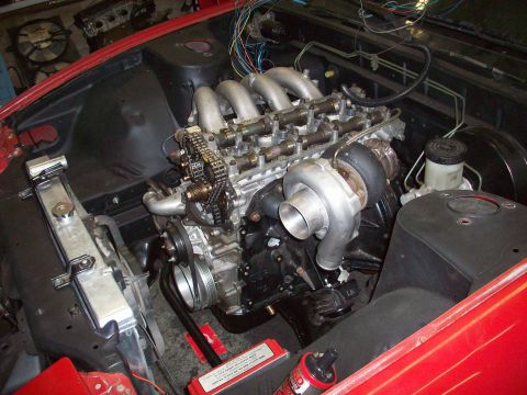 1990 Nissan Sentra - Close-up view of a turbocharged engine installed in a vehicle's engine bay.