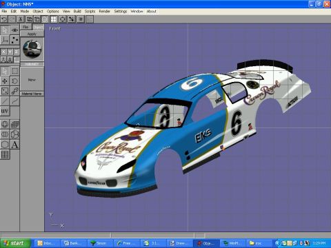 2004 Jeep Wrangler - A digital rendering of a race car body, likely for simulation or design purposes, is displayed on a computer screen.