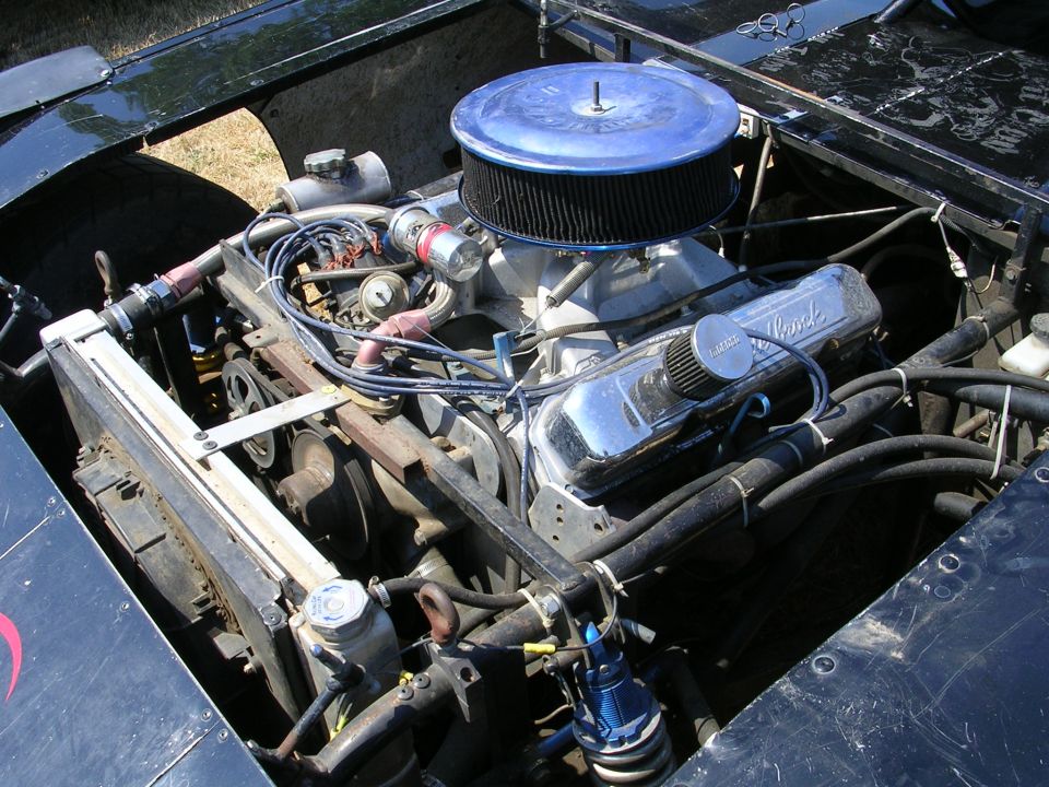 Engine bay with chrome valve covers and blue air filter