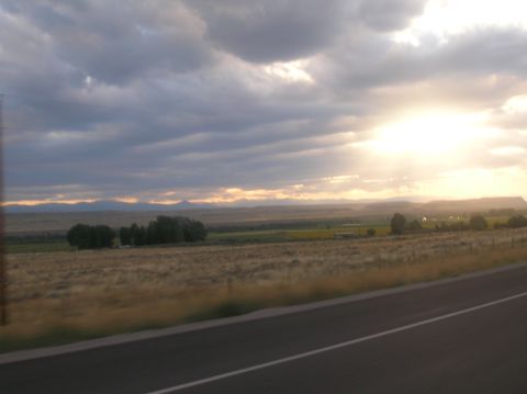 1996 Ford Bronco - Sunset over a rural landscape viewed from a highway.