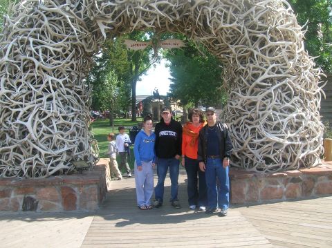 1996 Ford Bronco - A family stands beneath a massive arch constructed entirely from antlers, a landmark in Jackson Hole, Wyoming.