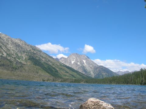 1996 Ford Bronco - A lake scene with mountains in the background under a clear blue sky.