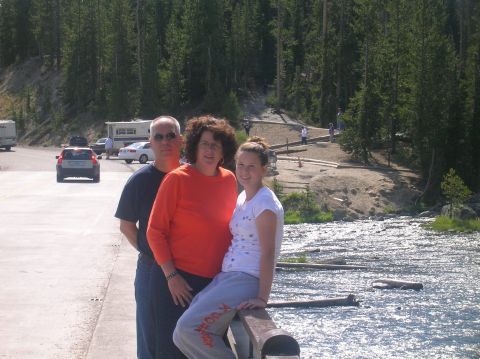 1996 Ford Bronco - A family poses for a photo in a scenic outdoor location with a river and trees.