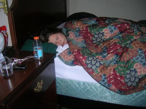 1996 Ford Bronco - Someone is catching some Zs next to a nightstand with a drink and phone.