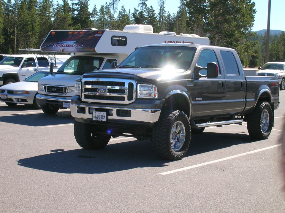 Dark gray Ford F-250 Super Duty pickup truck, lifted, 3/4 front view
