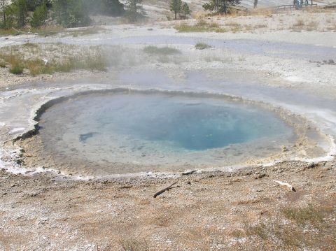 1996 Ford Bronco - A natural hot spring in a geothermal area, with steam visible above the water's surface.