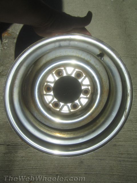 1987 Suzuki Samurai - Photograph of a 6-lug steel wheel rim, not a technical document.