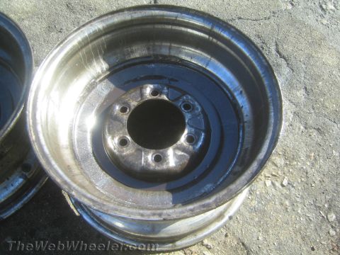 1987 Suzuki Samurai - Photograph of a steel wheel rim hub and barrel, not a technical document.