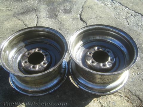 1987 Suzuki Samurai - Photograph of a matched pair of steel wheel rims, not a technical document.