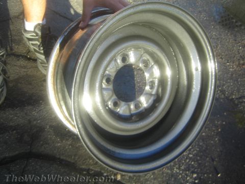 1987 Suzuki Samurai - Photograph of a polished steel wheel rim, not a technical document.