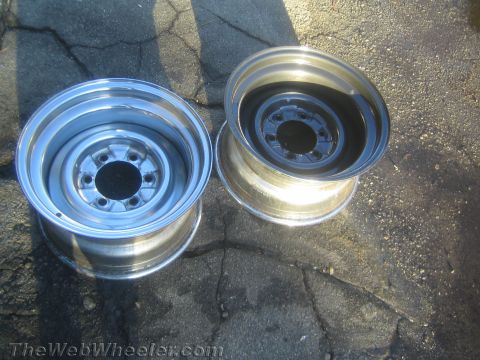 1987 Suzuki Samurai - Photograph of two steel wheel rims, not a technical document.