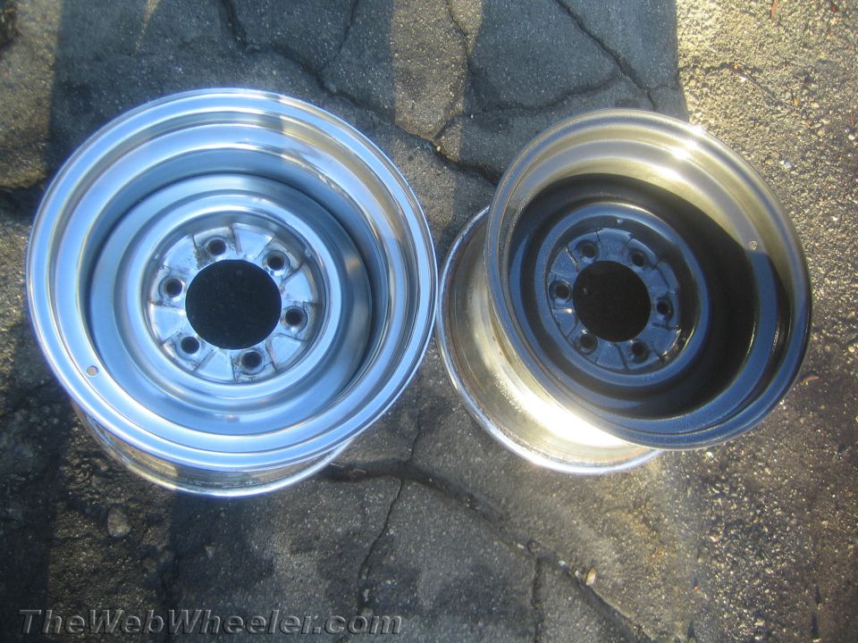 Two steel wheel rims of differing widths viewed from above