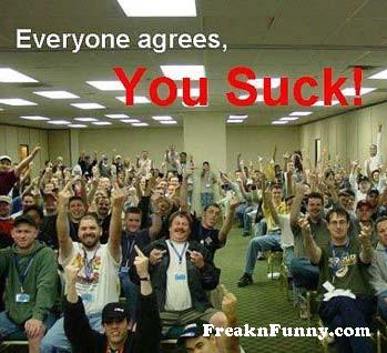 1992 Ford Mustang - A large group of people seated in a room raising their hands and pointing, with overlaid text reading 'Everyone agrees, You Suck!' and a Fr…