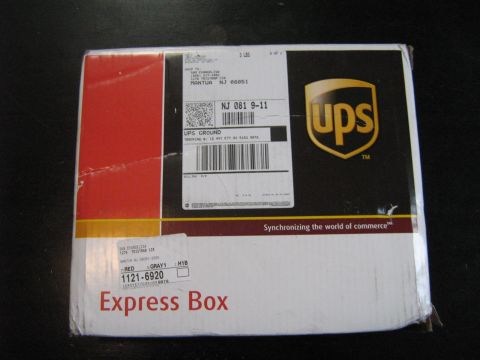 1990 Ford Bronco - A UPS Express Box is shown with shipping labels, including tracking numbers and destination information.
