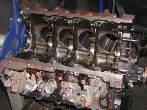 2007 Ford Mustang - Photograph of a V8 engine block showing main bearing caps and cylinder bores, a physical part not a diagram.