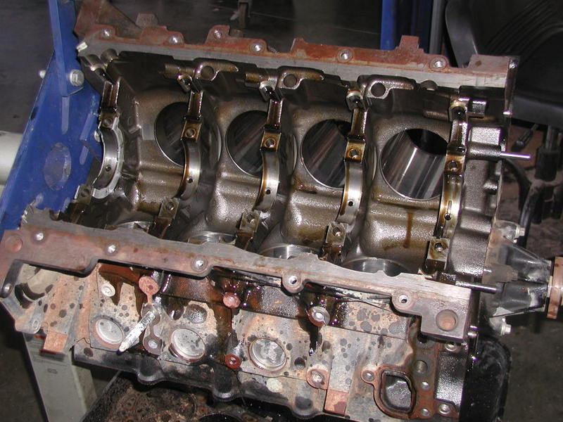 Photo of an engine block with crankshaft main bearing caps installed