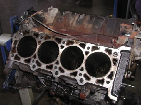 2007 Ford Mustang - Photograph of an engine block deck surface with a head gasket and visible cylinder bores, not a document.