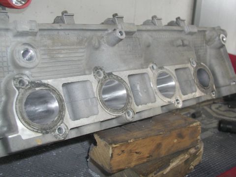 2007 Ford Mustang - Photograph of a cylinder head intake face with port openings, a physical part not a diagram.