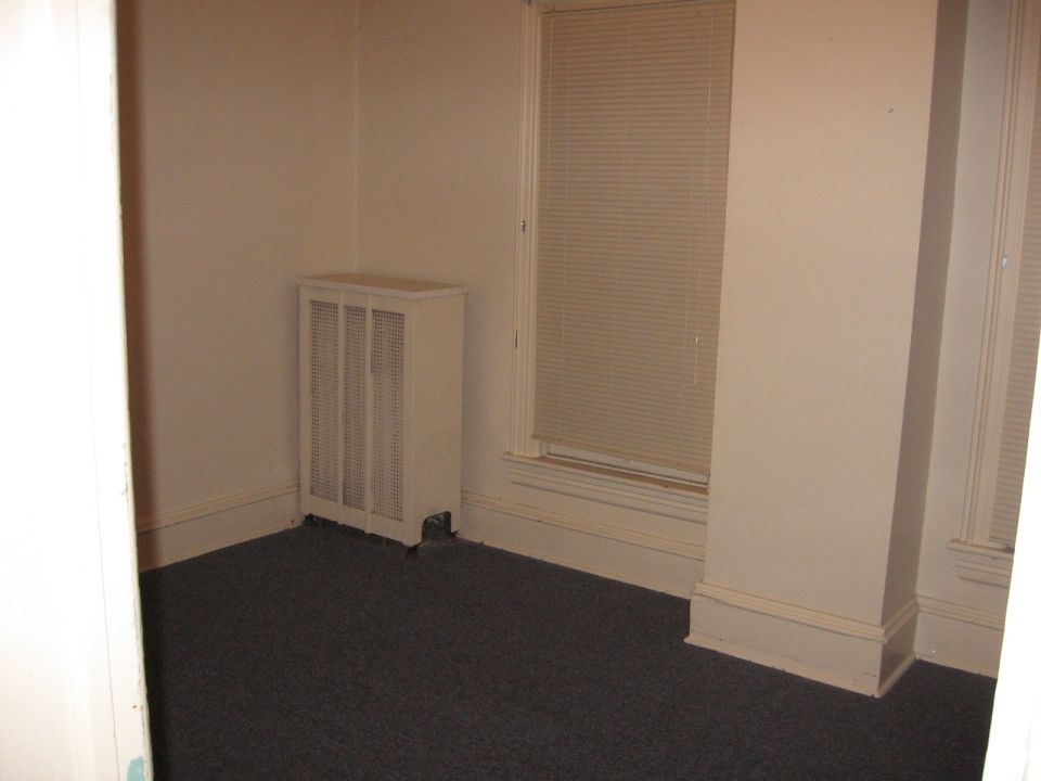 Empty room with radiator and window