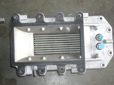 2007 Ford Mustang - Close-up of a Ford supercharger intercooler assembly, showing the internal fins and gasket.