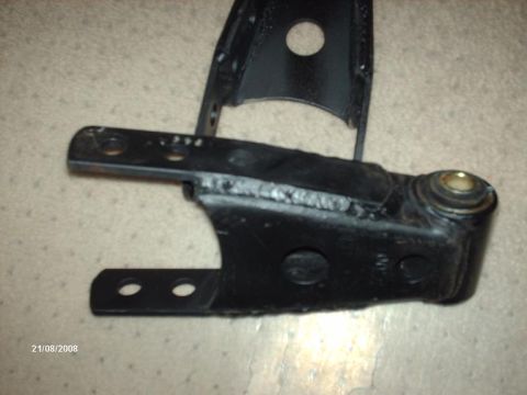 1990 Ford F-150 - A close-up view of a black metal automotive suspension component.