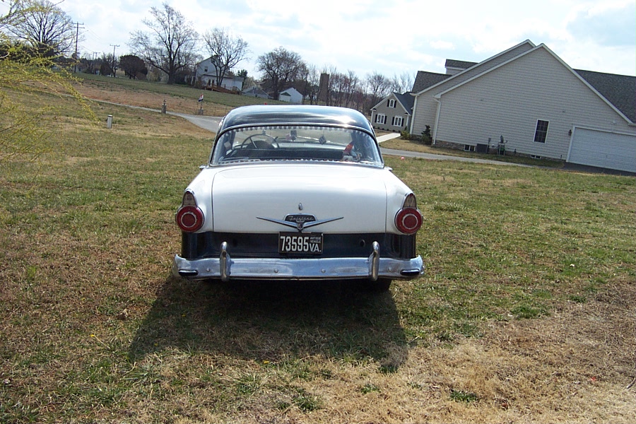 White and black 1956 Ford Fairlane rear view, chrome bumper, round taillights, license plate 73595 VA
