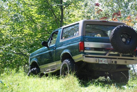1996 Ford Bronco - This 1996 Ford Bronco is seen from the rear quarter angle, with a spare tire mounted on the tailgate.