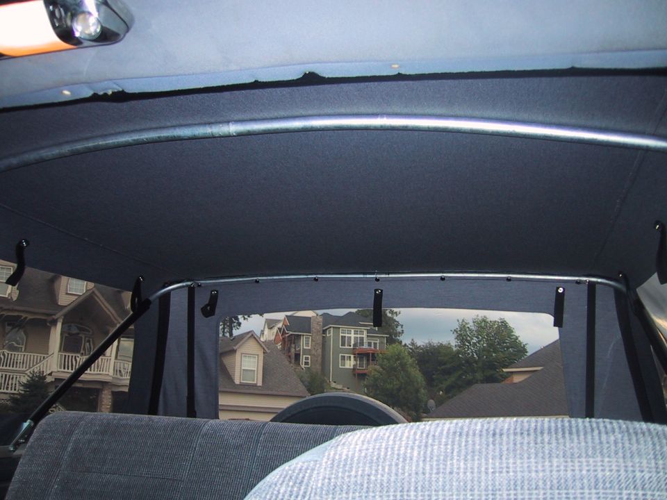 Interior view of a 1989 Ford Bronco soft top, showing the headliner and rear window frame