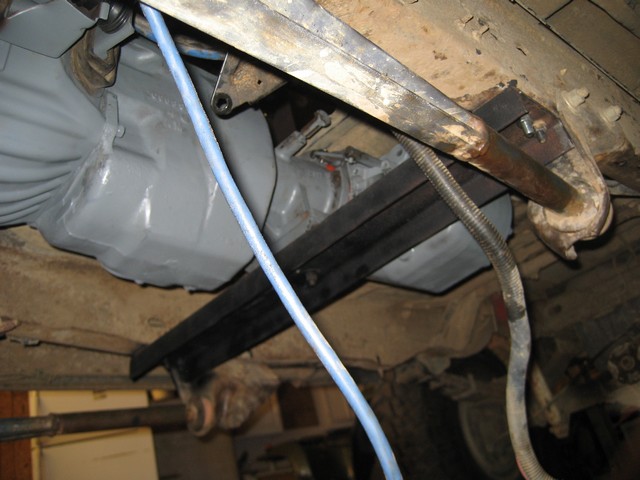Underside of a 1995 Ford Bronco showing transmission, exhaust, and custom crossmembers.