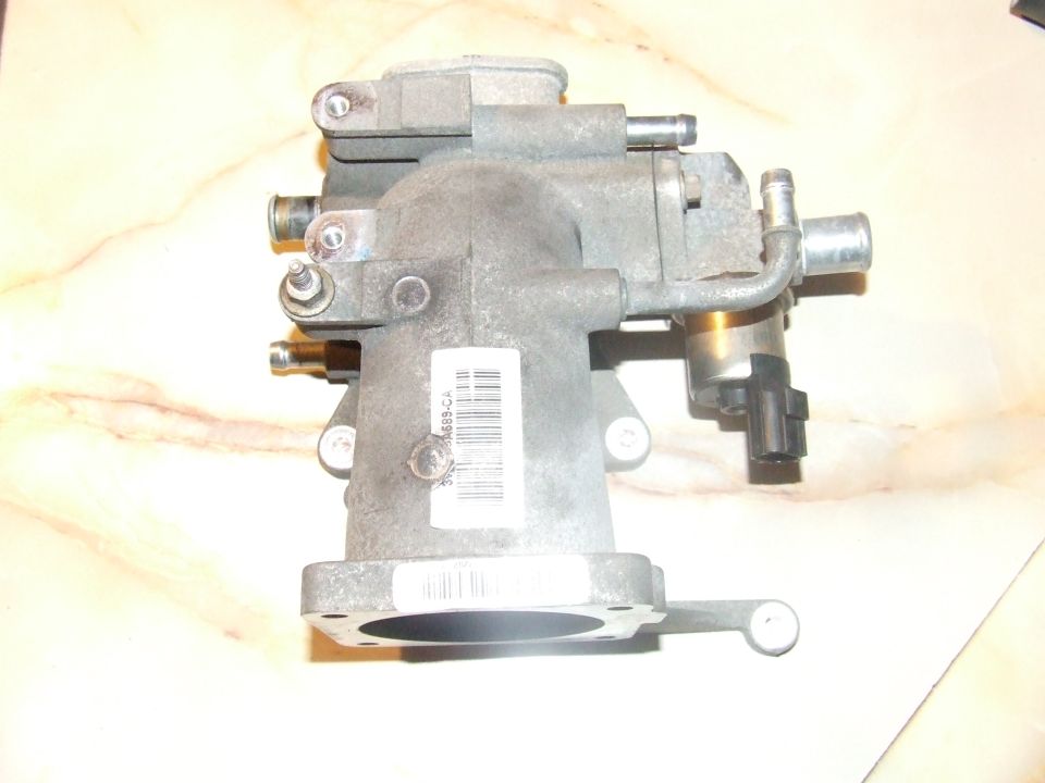 Gray metal throttle body assembly with tubes and sensor