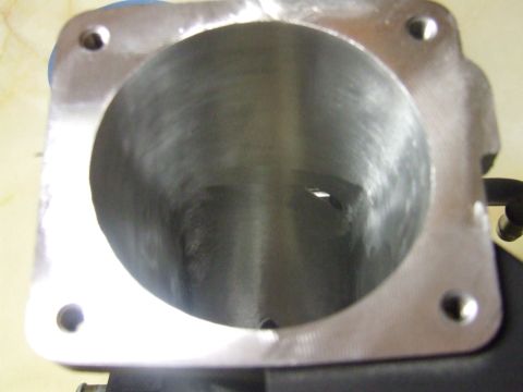 2003 Ford Crown Victoria - A close-up view of the inside of a metal cylinder bore, likely from an engine component. The bore has visible machining marks and a slightl…
