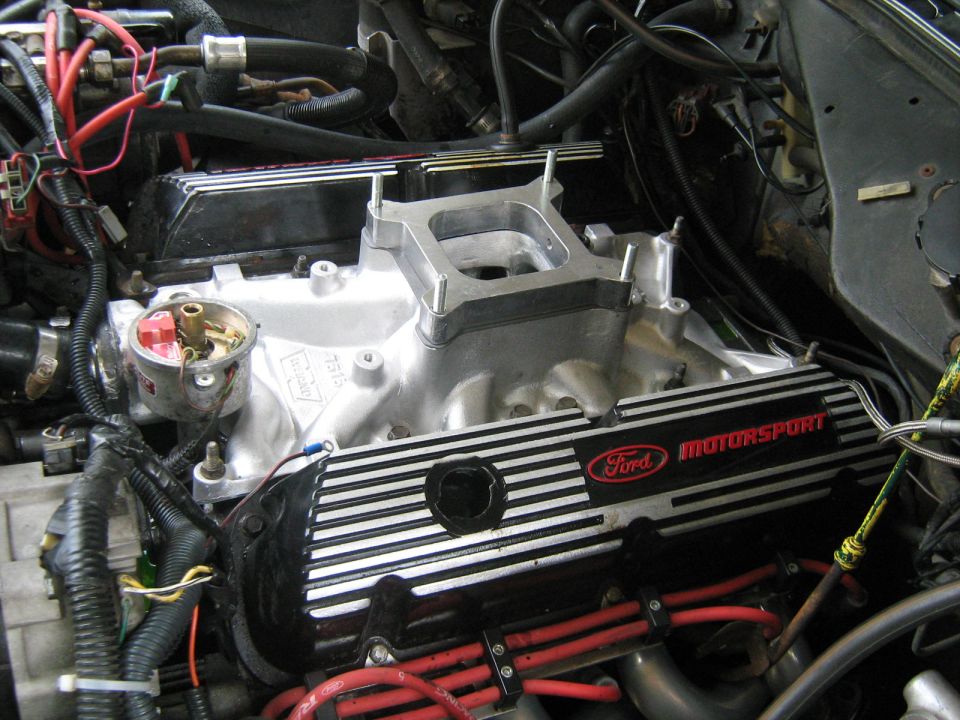 Ford Motorsport engine with silver intake and striped valve covers