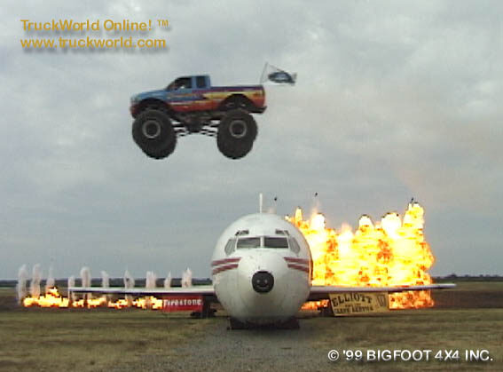 Blue Bigfoot monster truck jumping airborne over an airliner amid fireballs