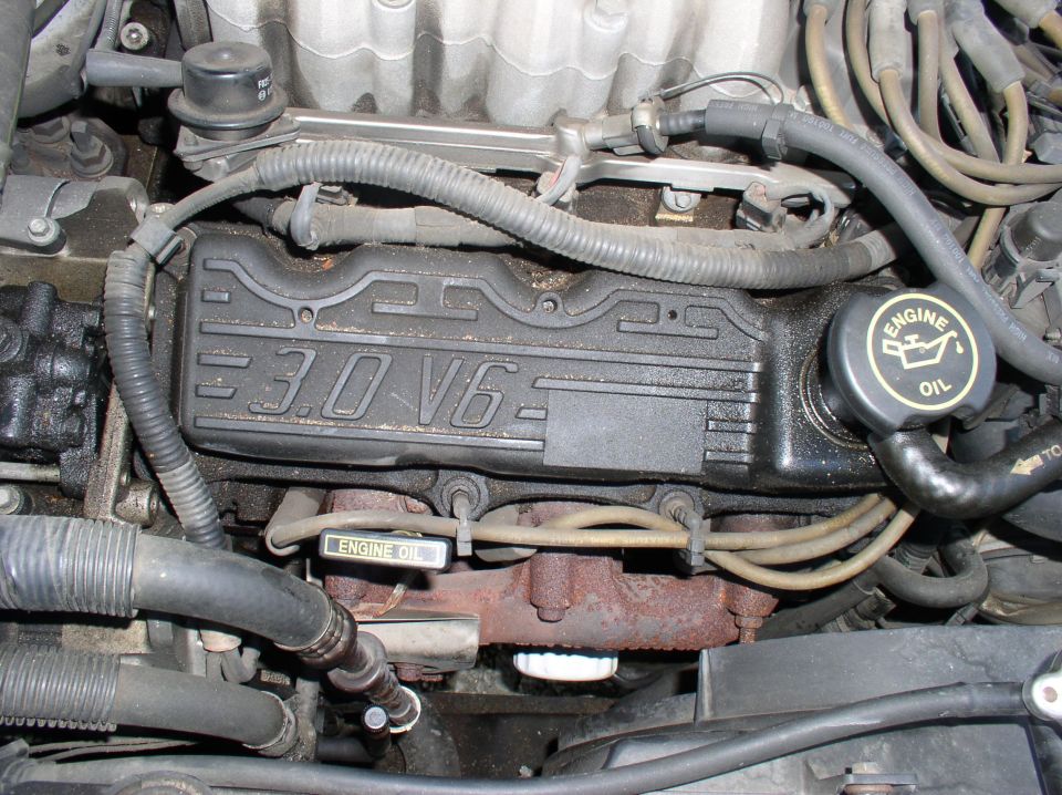 Black 3.0 V6 engine valve cover with round ENGINE OIL filler cap and hoses